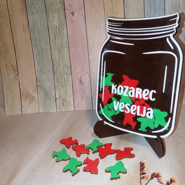 Kozarec veselja z žetoni v obliki avionov, motivacijski pripomoček
